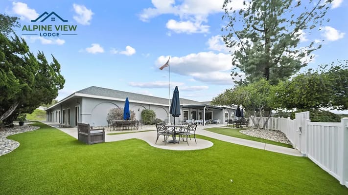 Exterior view of Alpine View Lodge with outdoor seating