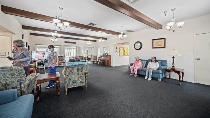 Residents and staff interacting in a common area
