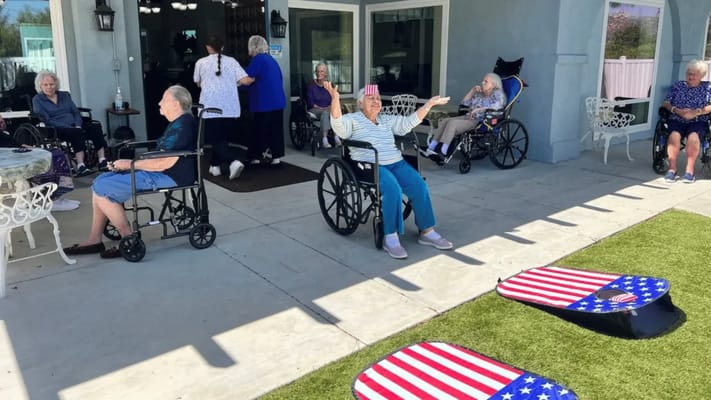 Residents enjoying time outdoors in wheelchairs