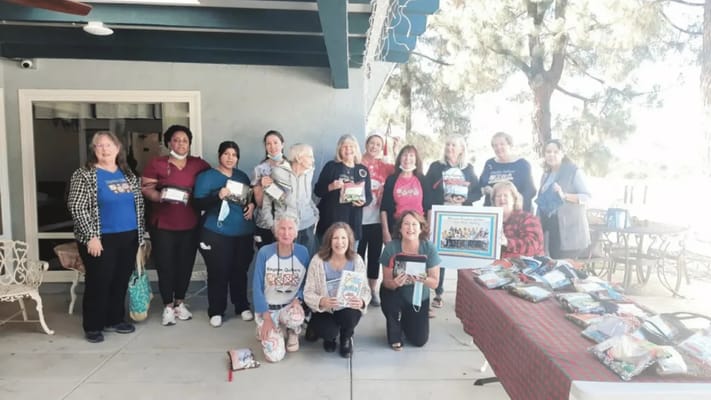 Group photo of staff and residents outside
