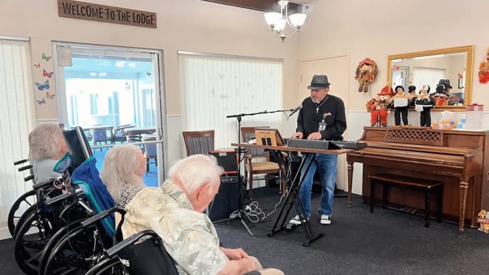 Residents enjoying live music in a common area