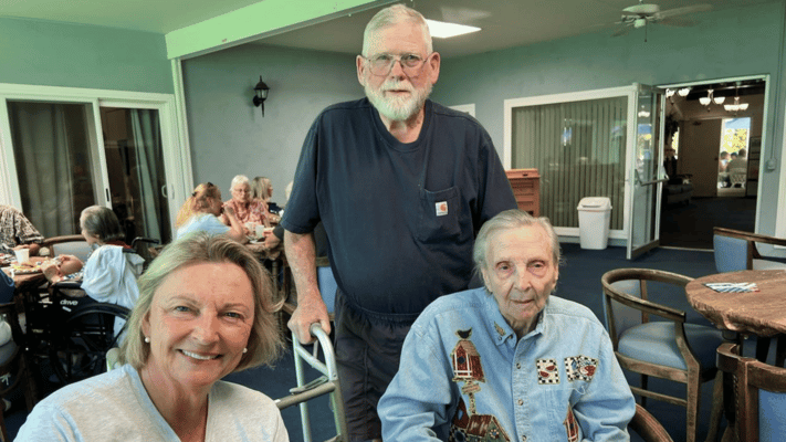 Residents and staff interacting in a common area