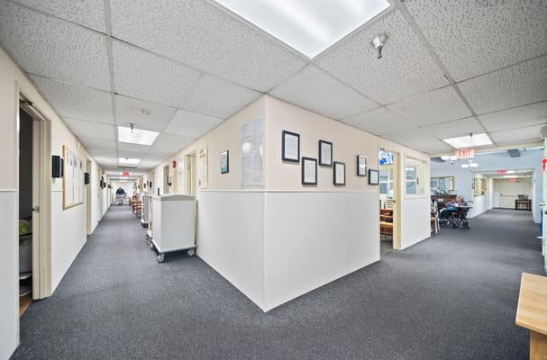Interior hallway with residents and staff