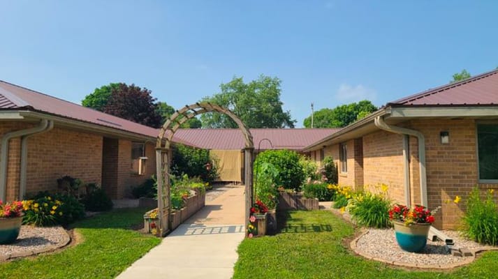 A garden area with flowers and a walkway
