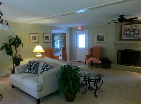 Cozy common area with comfortable seating and plants