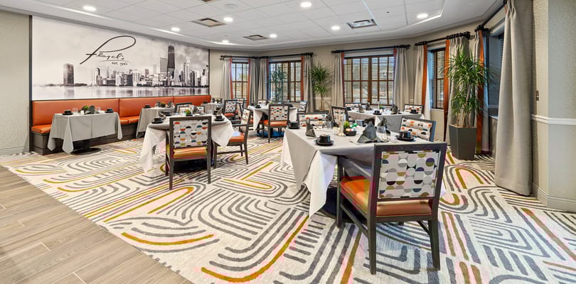 Bright dining room with tables set for meals