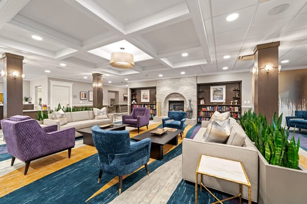 Bright and welcoming common area with seating and bookshelves