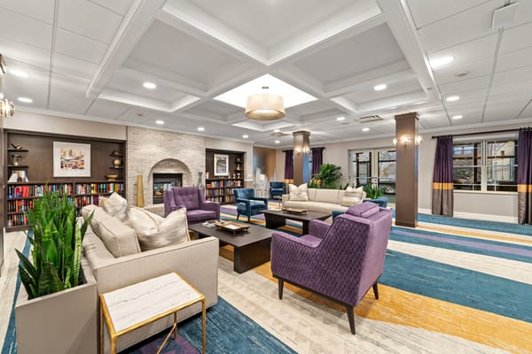 Interior common area with comfortable seating and bookshelves