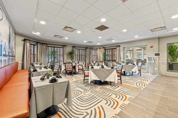 Bright dining area with modern decor and seating