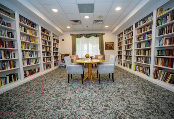 A cozy reading area with bookshelves and tables