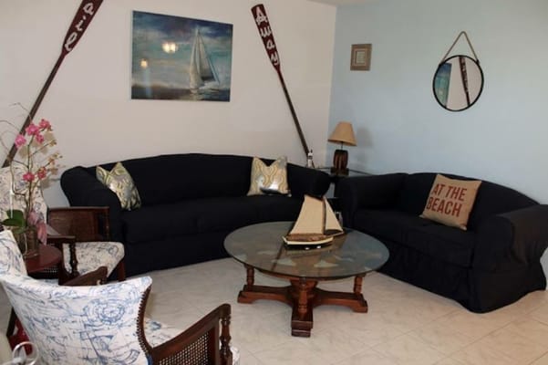 Spacious living room with comfortable seating and nautical decor