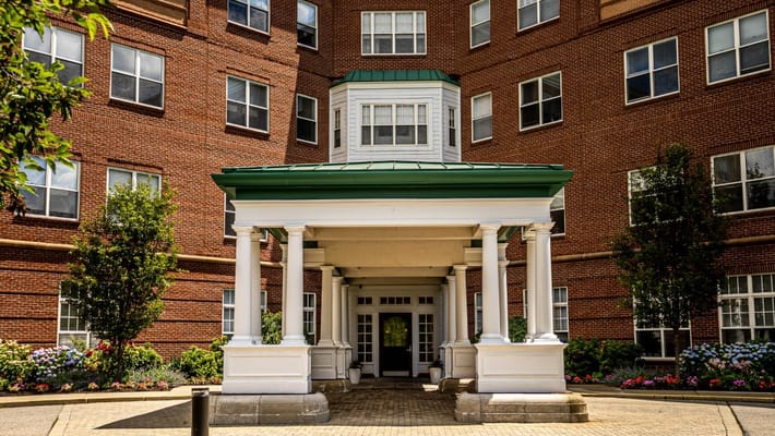 Facade of Wingate Residences entrance with landscaping