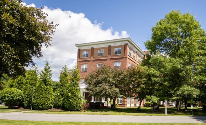 Exterior view of Wingate Residences surrounded by greenery