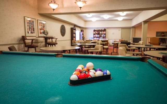 Interior view of a common area with a pool table