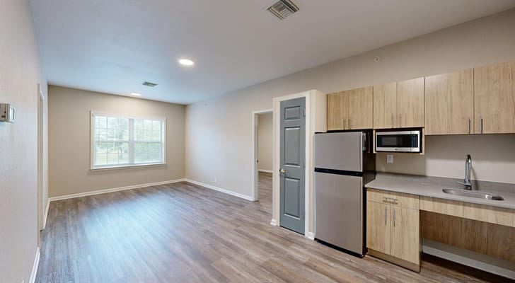 Interior view of a resident room with kitchenette
