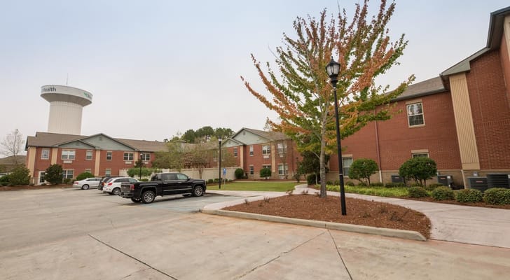 Exterior view of Crescent Landing with landscaping and parking