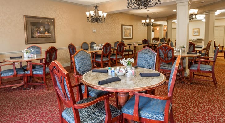 Elegant dining room with wooden tables and chairs