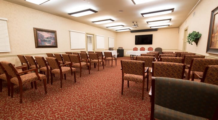 Bright interior room with chairs arranged for an event