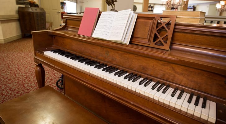 Piano with sheet music in an elegant common area