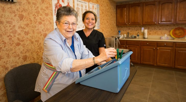 Resident engaging in an activity with a staff member