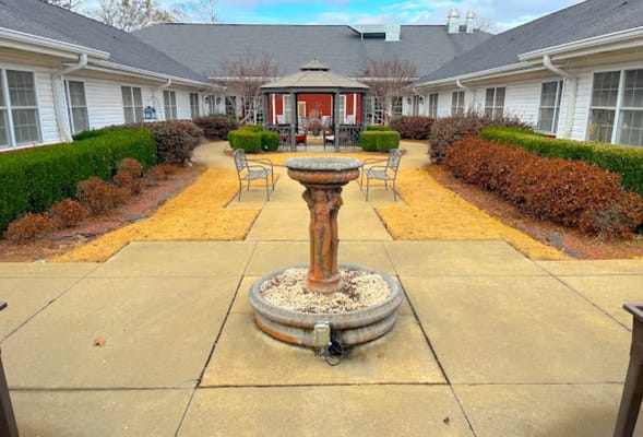 Beautiful garden courtyard with fountain and seating