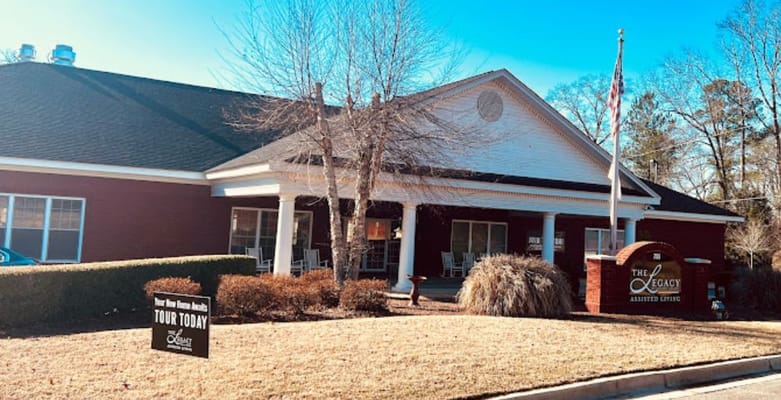 Front entrance of a senior living facility with outdoor signage