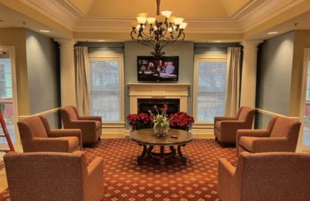Welcoming common area with chairs and television