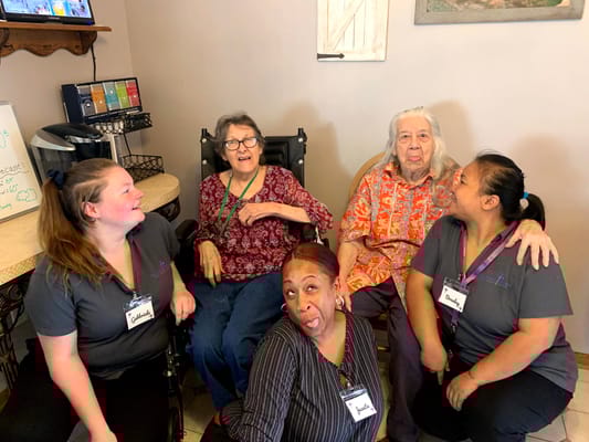Residents and staff enjoying time together in a common area