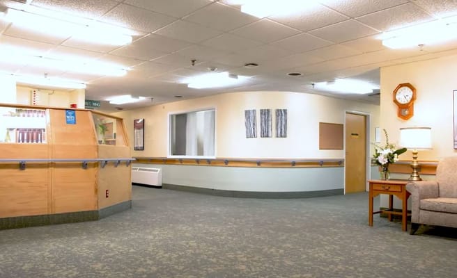 Interior view of a facility common area with seating