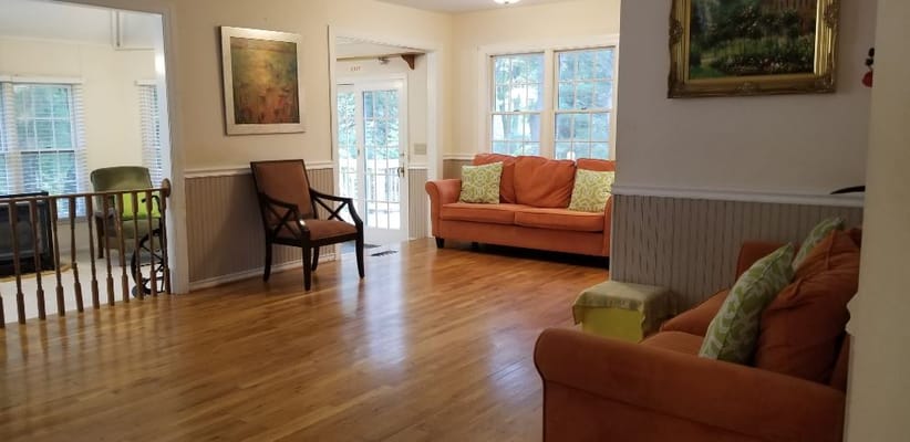 Bright common area with seating and windows