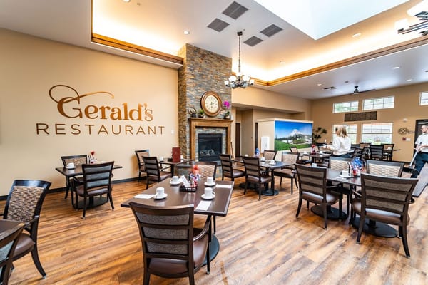 Dining area with tables and a fireplace