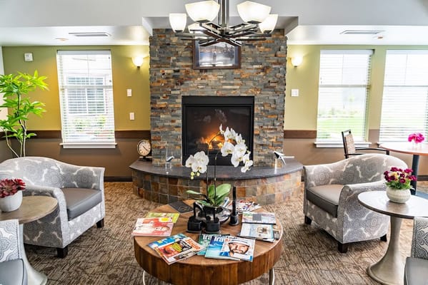 Cozy common area with seating and a fireplace