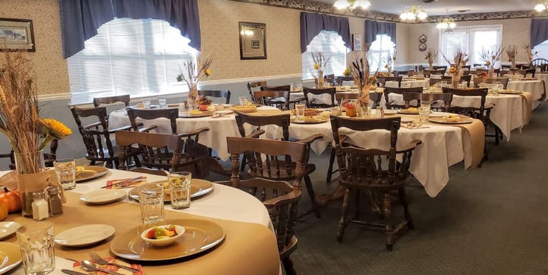 Cozy dining room with tables set for meals at Summit View