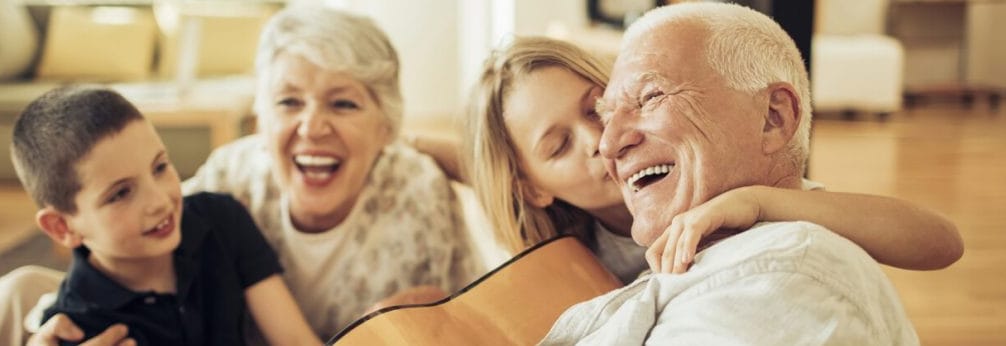 Seniors enjoying time with grandchildren indoors