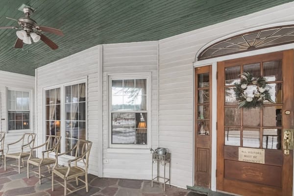 Entrance of a senior living facility with seating area