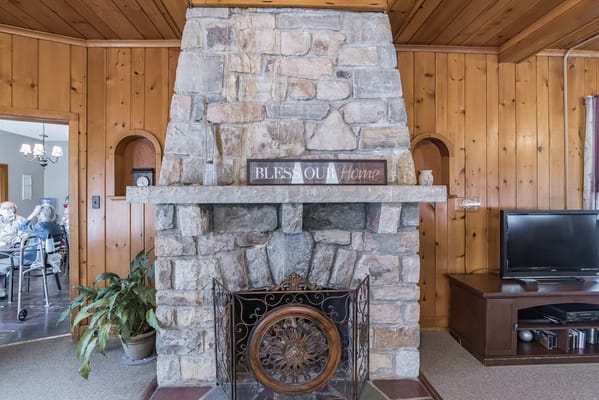 Cozy interior with stone fireplace and decorations