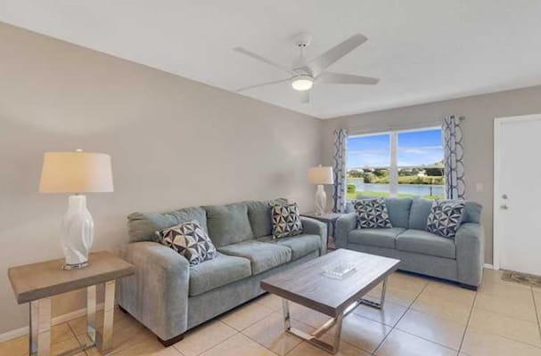 Bright living room with couches and a view
