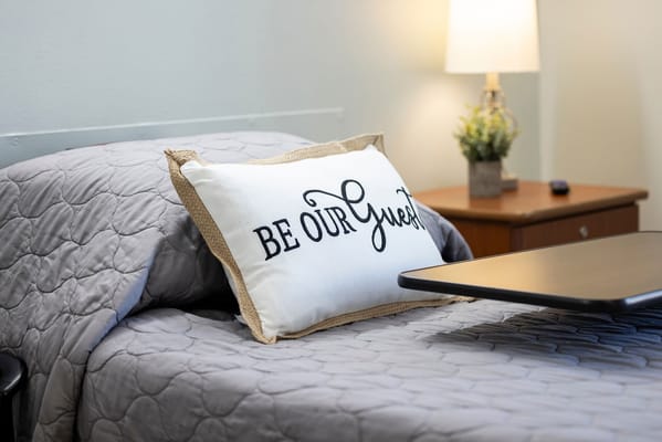 Cozy bedroom setup with a welcoming pillow
