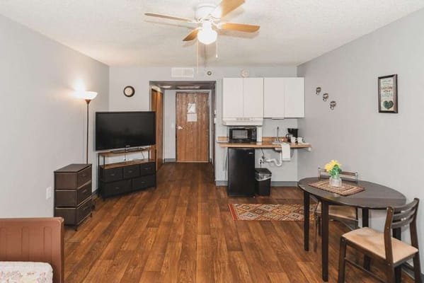 Interior view of a private resident room with kitchen
