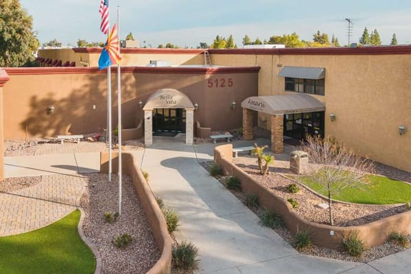 Exterior view of Amarsi Assisted Living entrance and landscaping