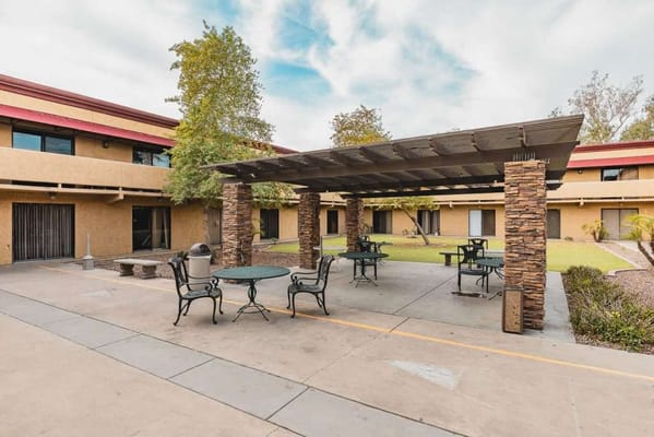 Outdoor seating area with shaded tables