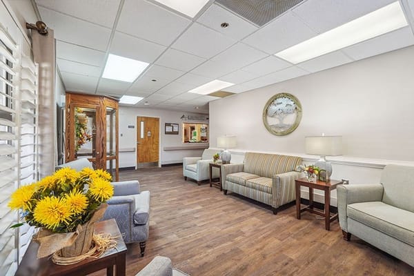 Cozy common area with seating and flowers