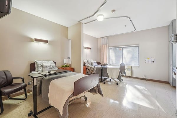 Interior view of a shared bedroom in a nursing facility