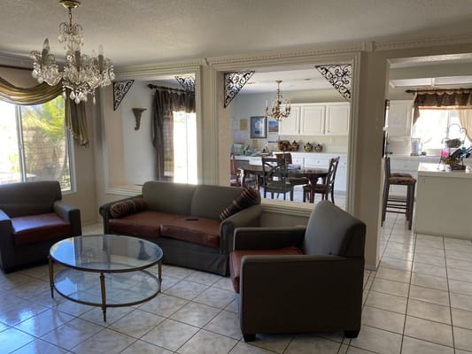Spacious living room with comfortable seating and dining area