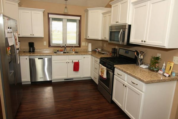 Bright kitchen area with modern appliances