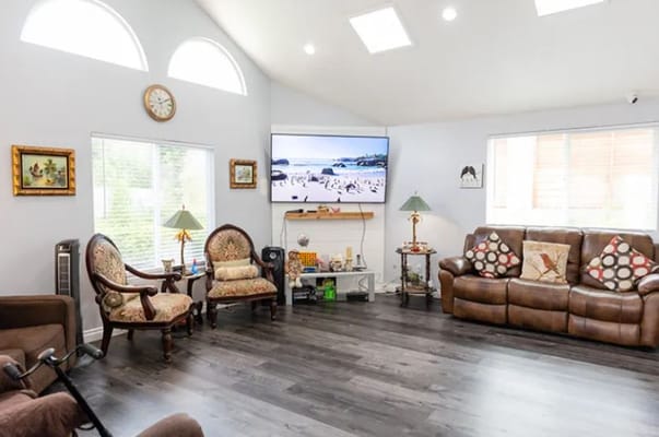 Cozy common area with seating and a TV