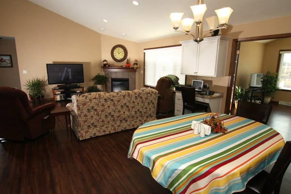 A cozy common area with a striped tablecloth and furnishings