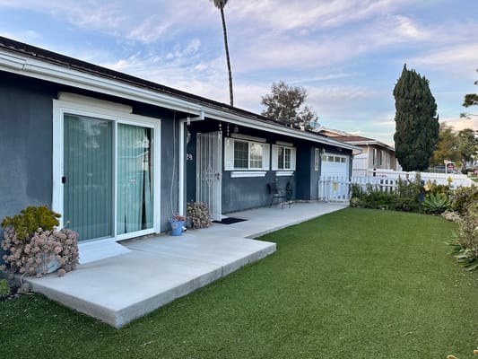 Exterior view of a senior living facility with a garden