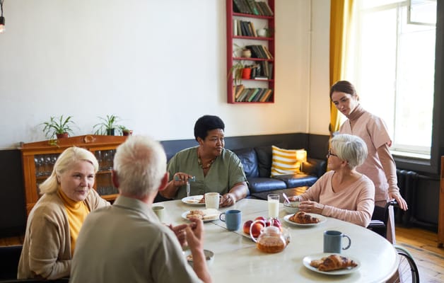 Residents enjoying a meal together in a common area