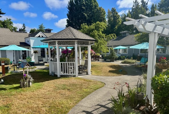 Outdoor garden area with gazebo and seating